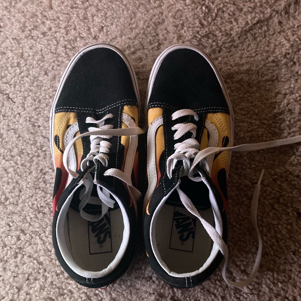 Black vans with printed flames.